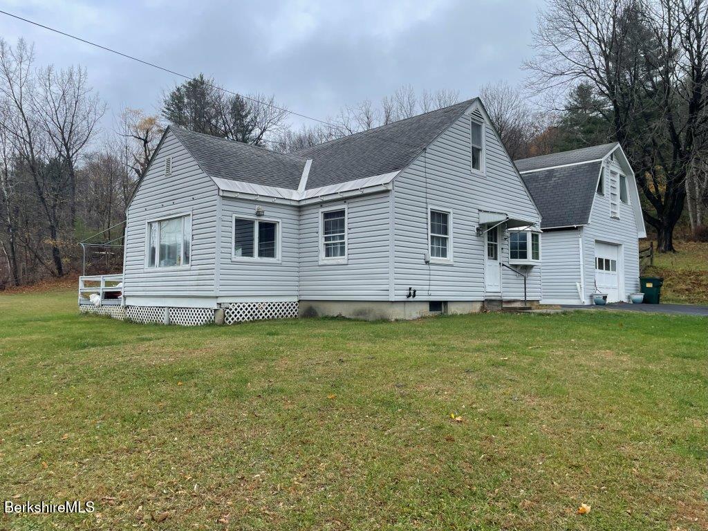 1320 Church Street North Adams, MA 01247 - Photo 4 of 33 a front view of house with yard and porch