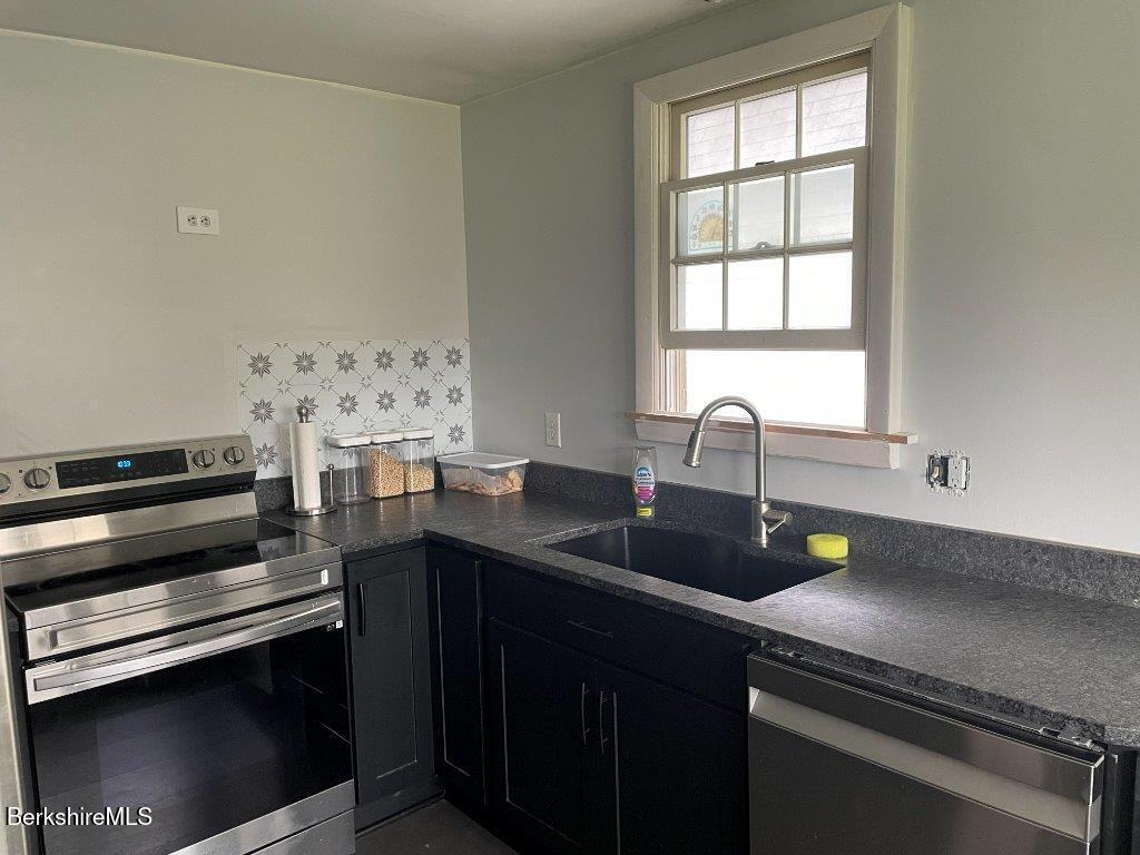 1320 Church Street North Adams, MA 01247 - Photo 6 of 33 a kitchen with a sink appliances and cabinets