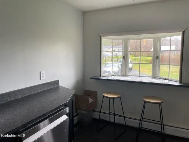 a kitchen with a table chairs and a stove