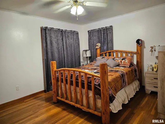 a bedroom with a bed and dresser