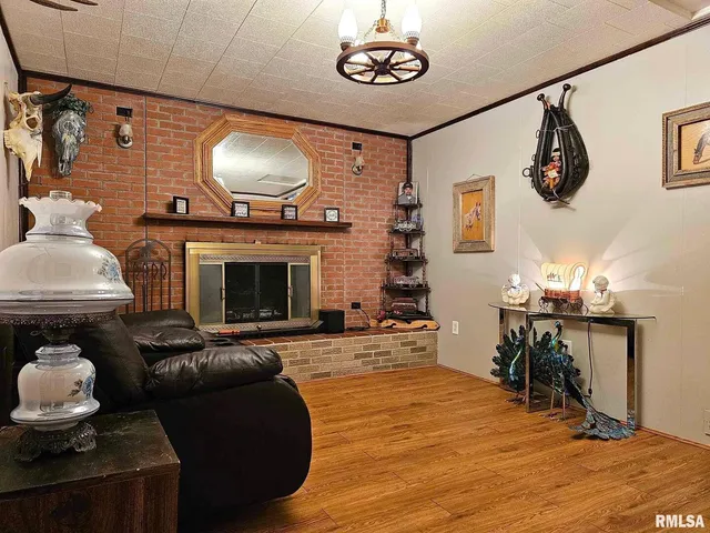 a view of a fireplace with wooden floor