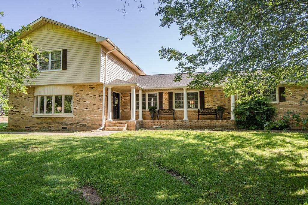 62 West Troutman Road Northeast Rome, GA 30165 - Photo 1 of 1 a front view of a house with a yard