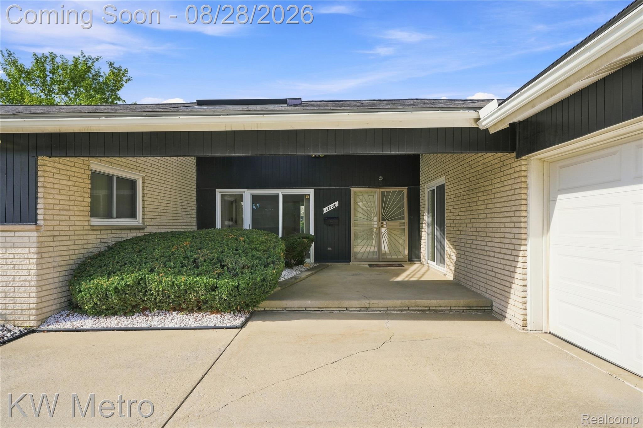17700 Adrian Road Southfield, MI 48075 - Photo 2 of 24 Brick exterior with covered entry, attached garage, and established landscaping