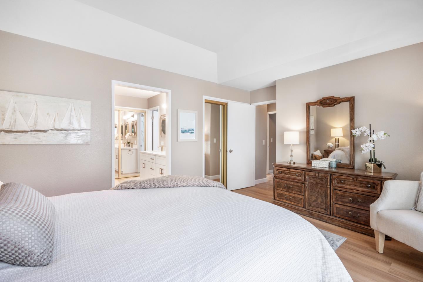 2153 Darnis Circle Morgan Hill, CA 95037 - Photo 15 of 33 a bedroom with a bed a chandelier and mirror