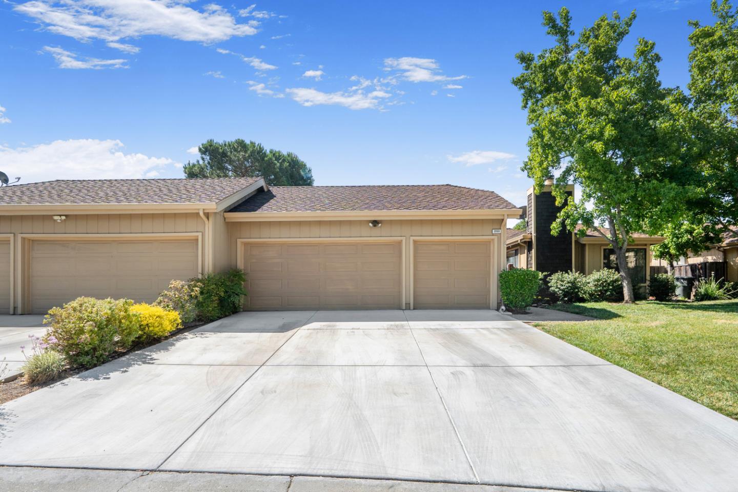 2153 Darnis Circle Morgan Hill, CA 95037 - Photo 2 of 33 a view of a white house with a yard and potted plants