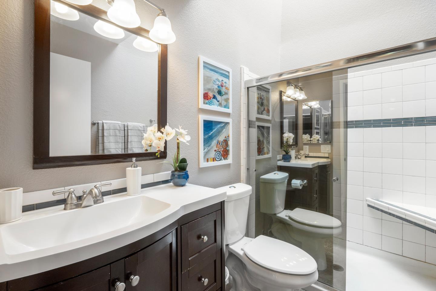 2153 Darnis Circle Morgan Hill, CA 95037 - Photo 23 of 33 a bathroom with a sink a toilet a mirror and shower