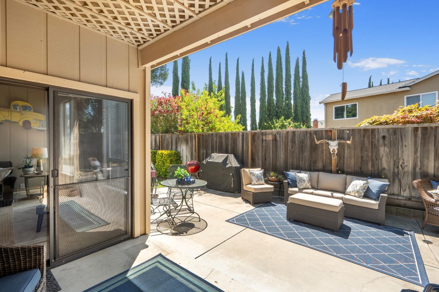 2153 Darnis Circle Morgan Hill, CA 95037 - Photo 28 of 33 a outdoor space with patio couch and glass door