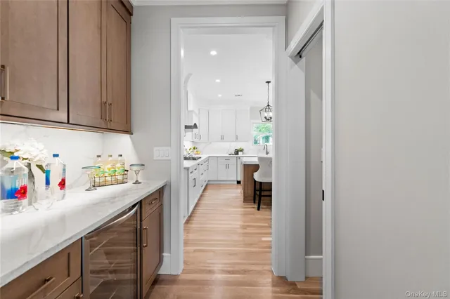 a view of a kitchen with counter top space and cabinets