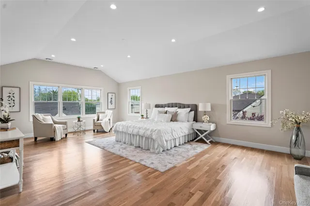 a spacious bedroom with a large bed and a couch