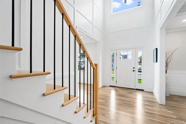 a view of an entryway with wooden floor