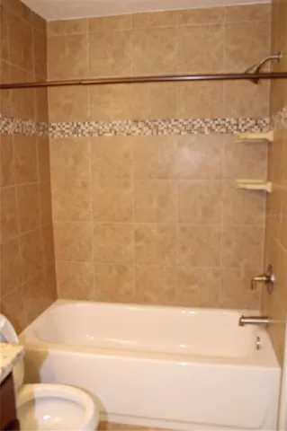 a bathroom with a bathtub and shower