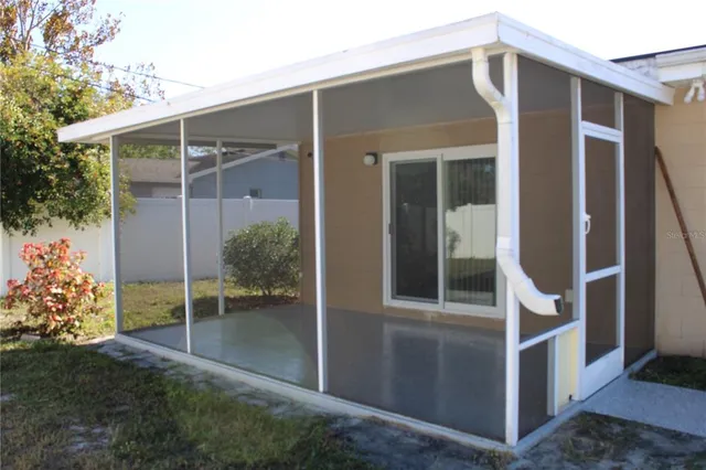 a house view with a backyard space