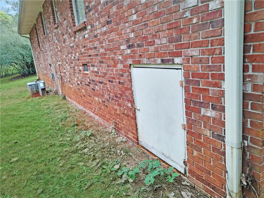 497 Highway 212 Covington, GA 30016 - Photo 13 of 14 a brick building with a yard