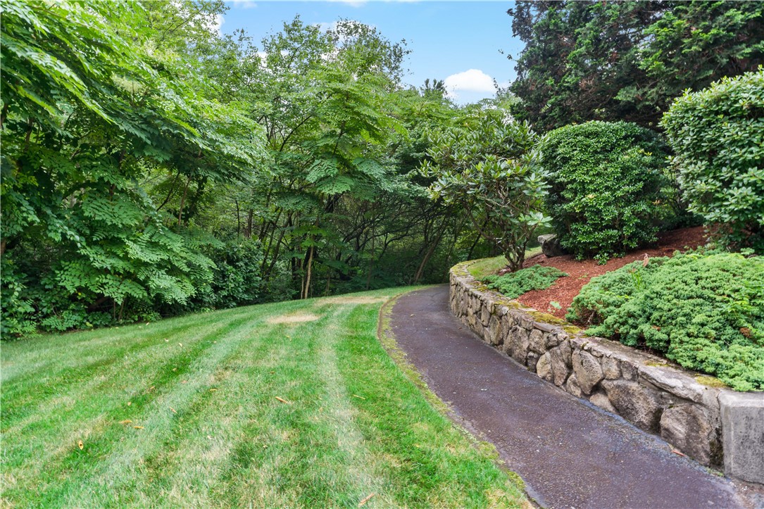 30 Argyle Avenue, Unit 201 Riverside, RI 02915 - Photo 32 of 37 walking path to pool and rear of property
