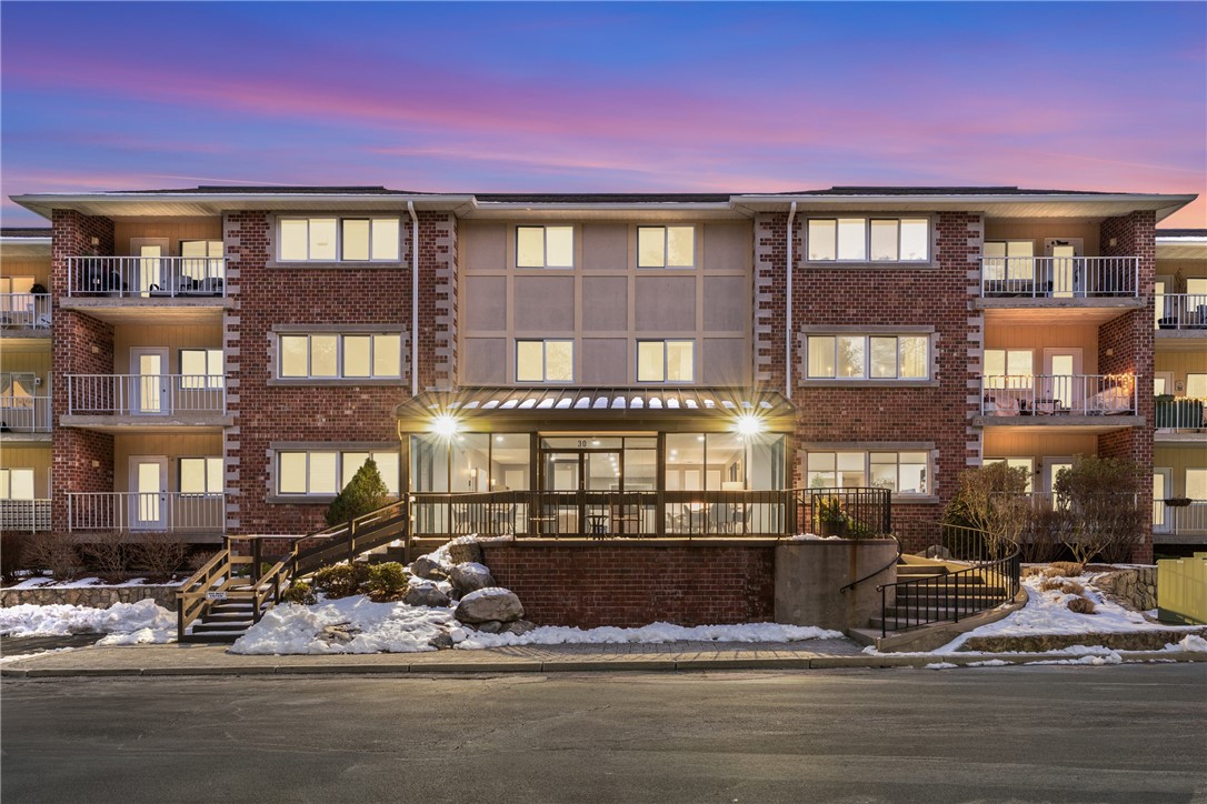 30 Argyle Avenue, Unit 201 Riverside, RI 02915 - Photo 5 of 37 front of property at twilight