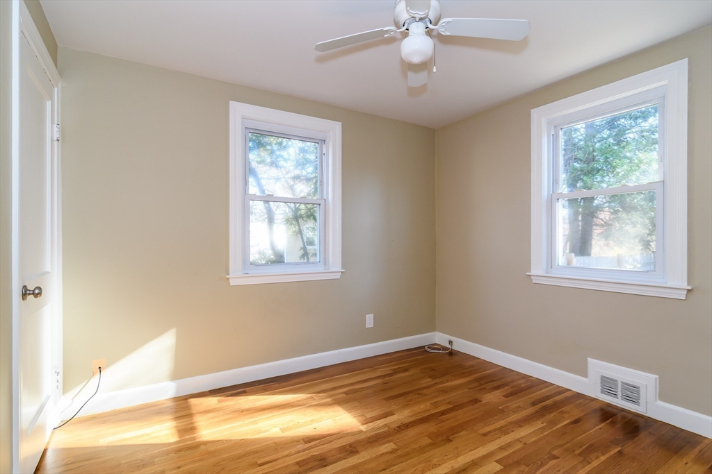 7 Ferndale Road Natick, MA 01760 - Photo 12 of 24 a view of an empty room with wooden floor and a window