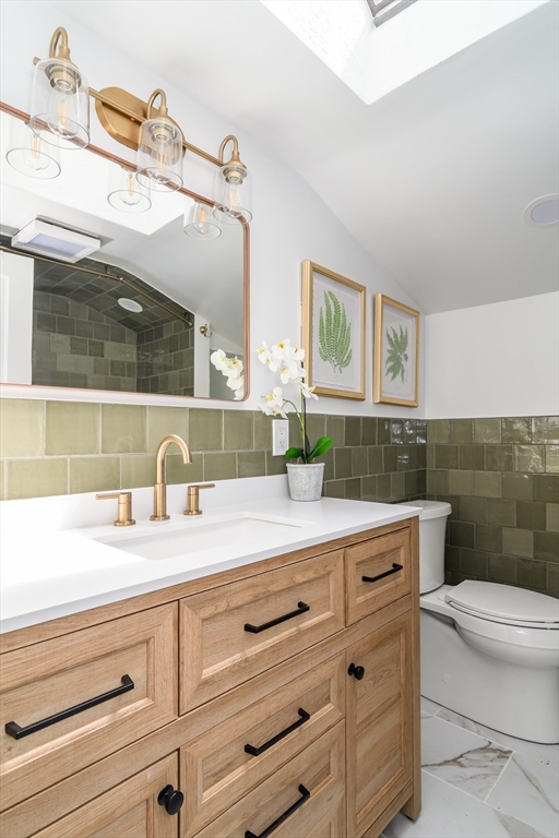 7 Ferndale Road Natick, MA 01760 - Photo 20 of 24 a bathroom with a sink a toilet and mirror