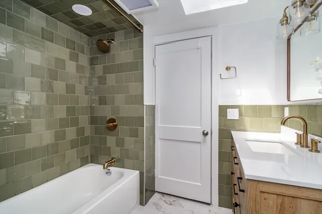 a bathroom with a sink and a bathtub