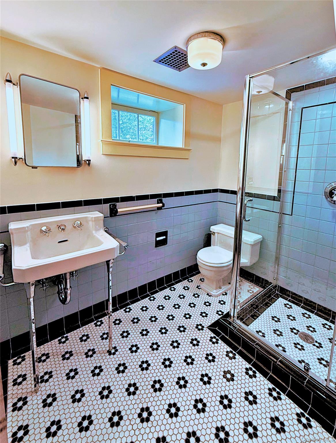 16 Locust Drive Cold Spring, NY 10516 - Photo 26 of 50 a bathroom with a sink a vanity and a mirror