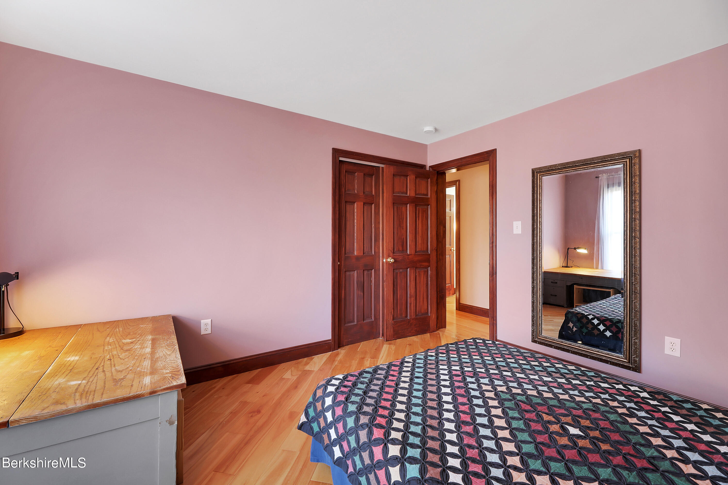 890 Dimmock Road Otis, MA 01253 - Photo 22 of 36 a bedroom with a bed and wooden floor