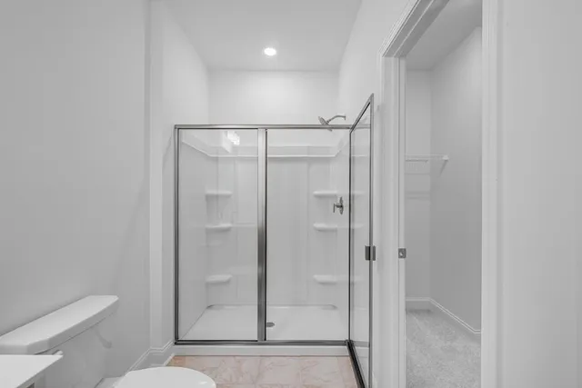a bathroom with a sink double vanity and a mirror