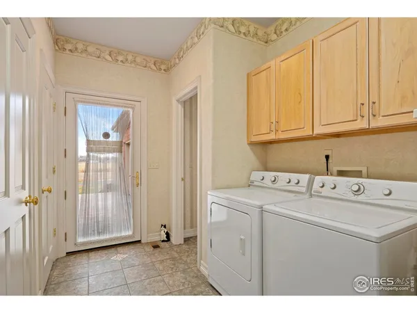 a bathroom with a potted plant and a shower