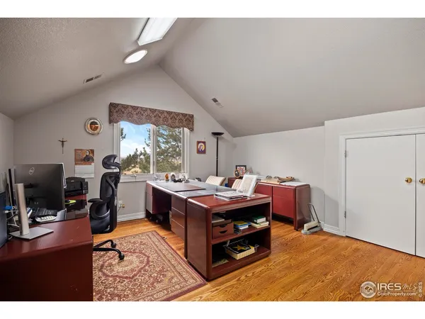 a bedroom with a bed chair and window