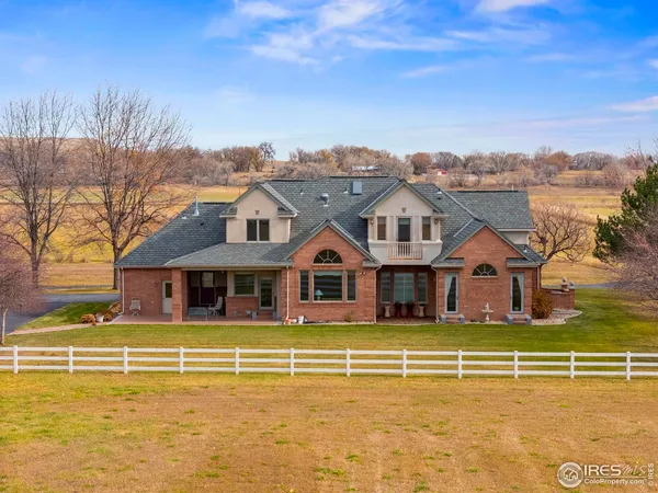 a room with furniture and a large window