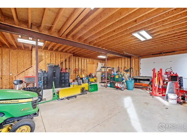 a view of an house with backyard and trees