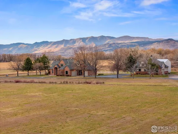 a view of a town with mountains in the background