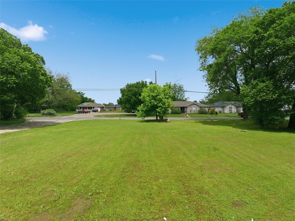 1119 Cherry Street Waco, TX 76704 - Photo 7 of 9 a view of a golf course with a lake