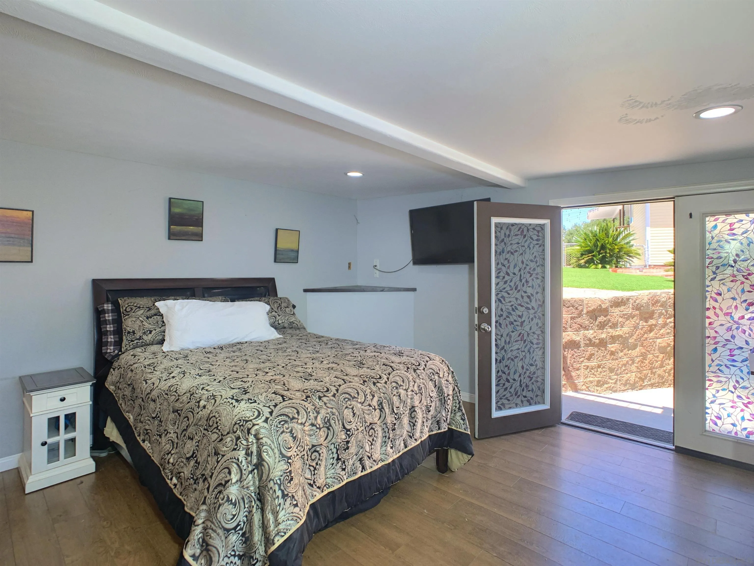 205 Highline Trail El Cajon, CA 92021 - Photo 37 of 45 a bedroom with a large bed and a large window