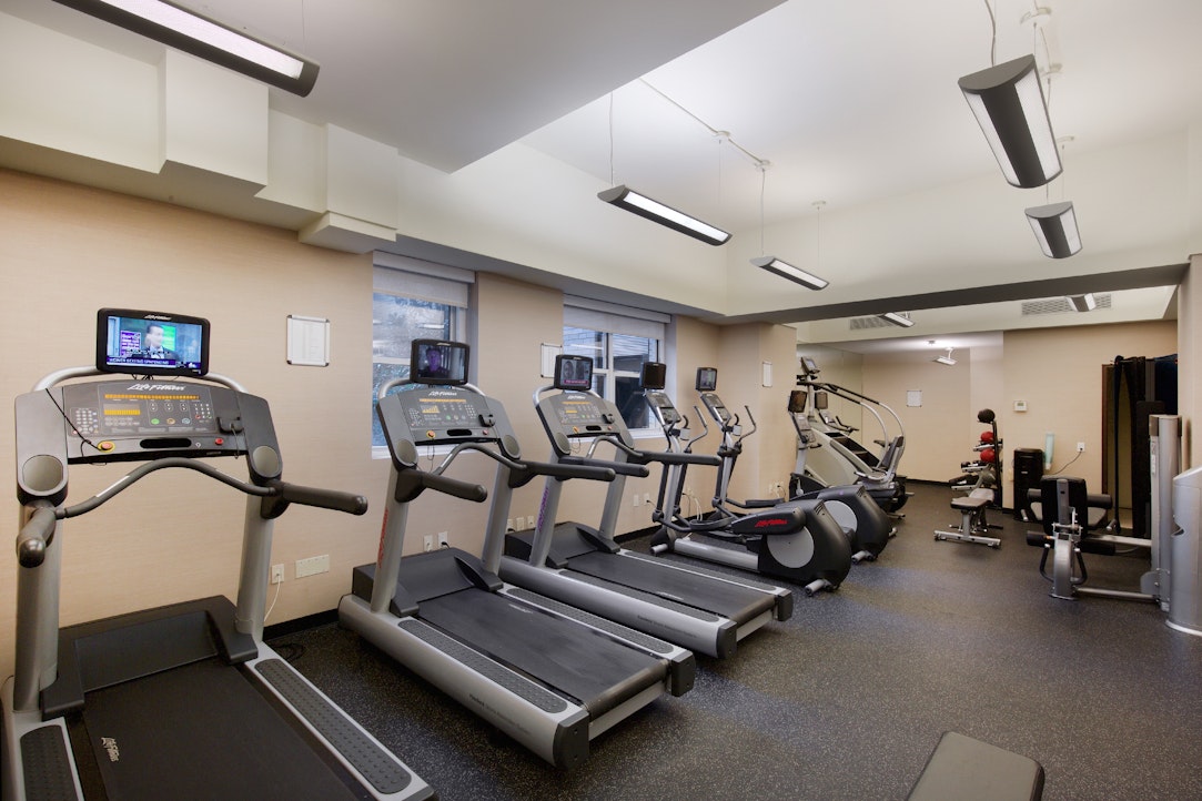 155 West 68th Street, Unit 1210 Manhattan, NY 10023 - Photo 13 of 17 a view of a room with gym equipment