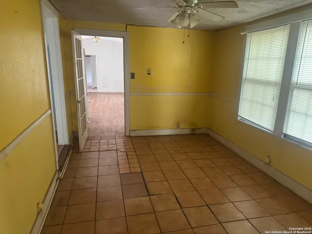 an empty room with fan