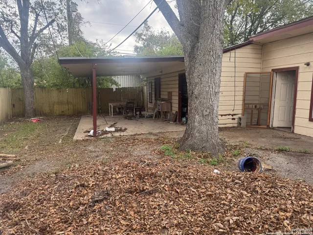 a view of a porch with furniture and yard