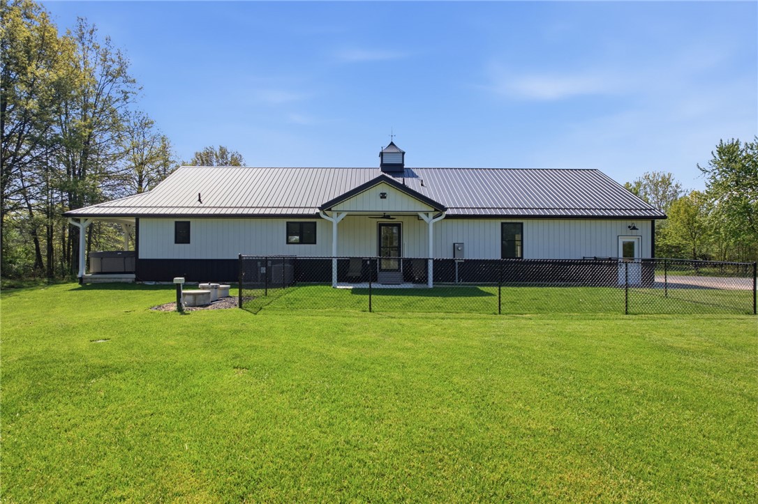1602 Westboro Road Blanchester, OH 45107 - Photo 1 of 81 This contemporary home features a sleek metal roof and a spacious yard.