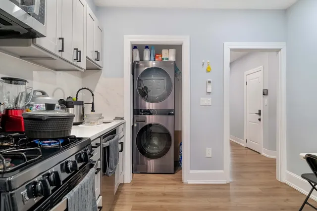 a kitchen with stainless steel appliances granite countertop a stove and a sink