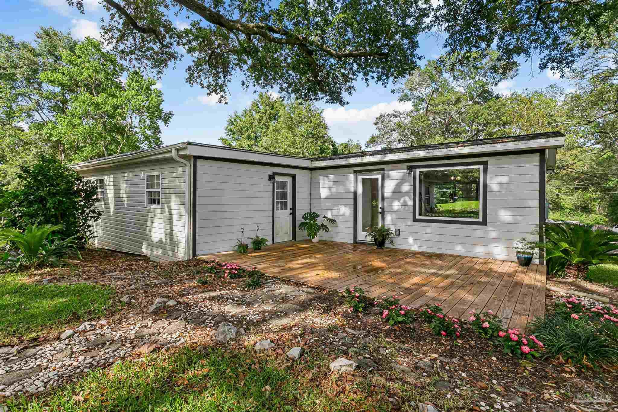 1095 River Annex Road Cantonment, FL 32533 - Photo 28 of 32 a backyard of a house with seating space