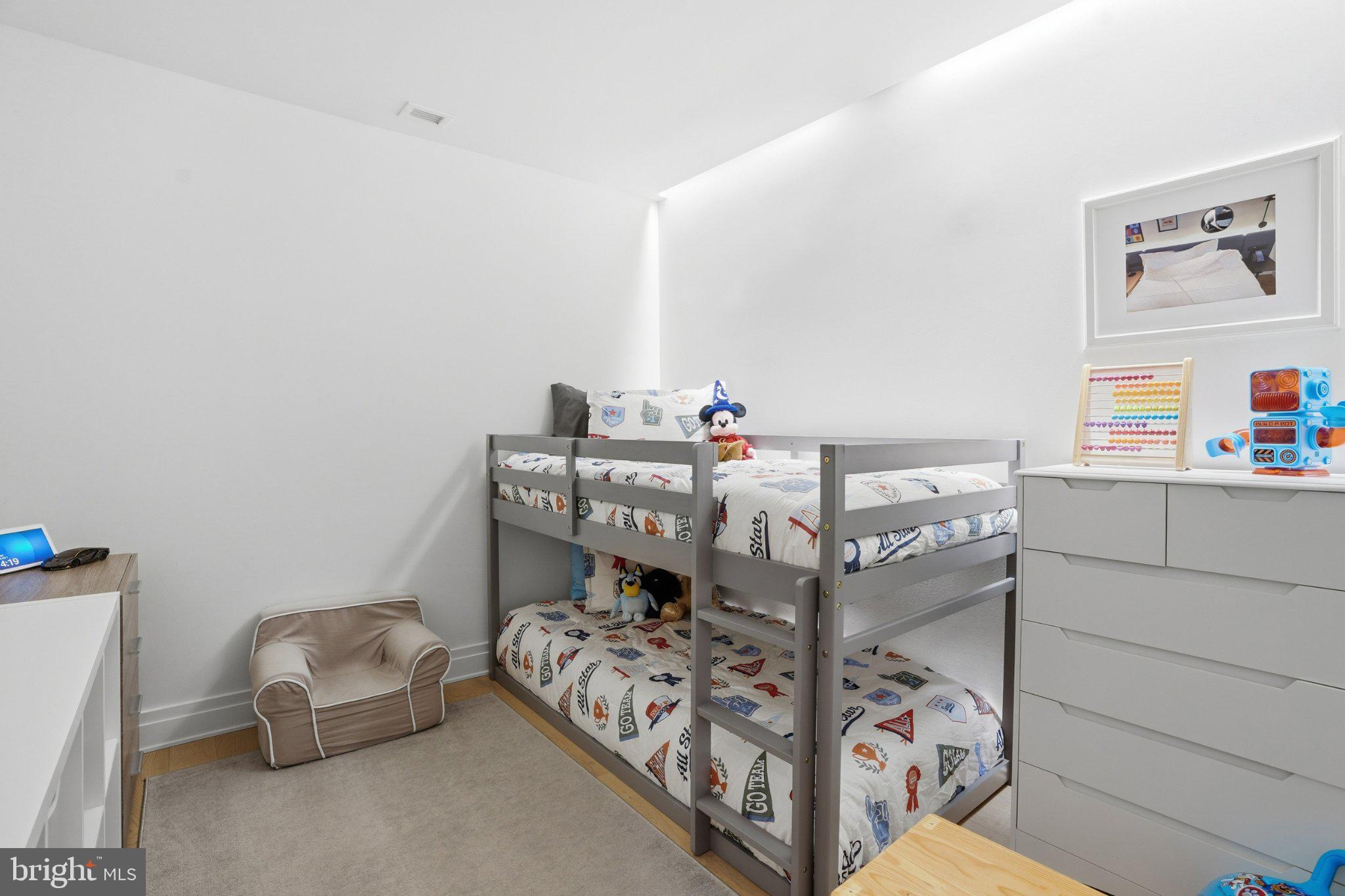 2501 M Street Northwest, Unit 209 Washington, DC 20037 - Photo 13 of 48 a bed sitting in a bedroom next to a window