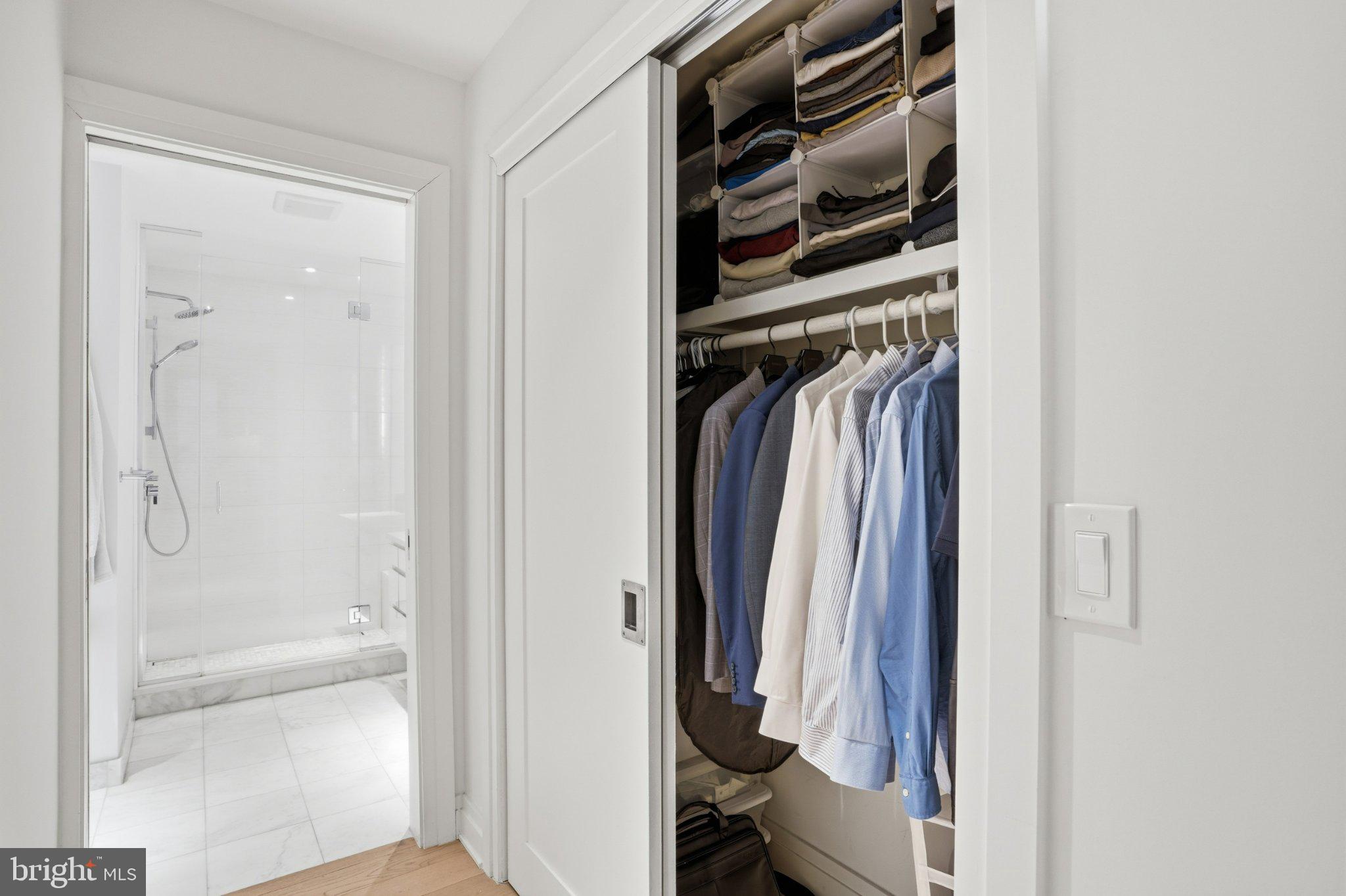 2501 M Street Northwest, Unit 209 Washington, DC 20037 - Photo 25 of 48 a view of walk in closet with clothes and shoes