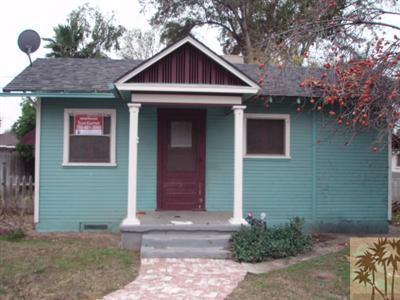 4258 Highland Place Riverside, CA 92506 - Photo 1 of 6 a front view of a house with garden