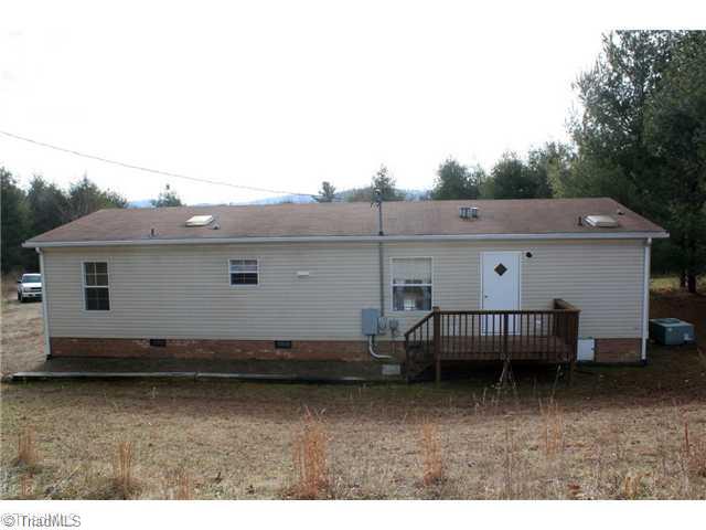 929 Alum Ridge Road Northwest Willis, VA 24380 - Photo 2 of 12 Exterior Back.