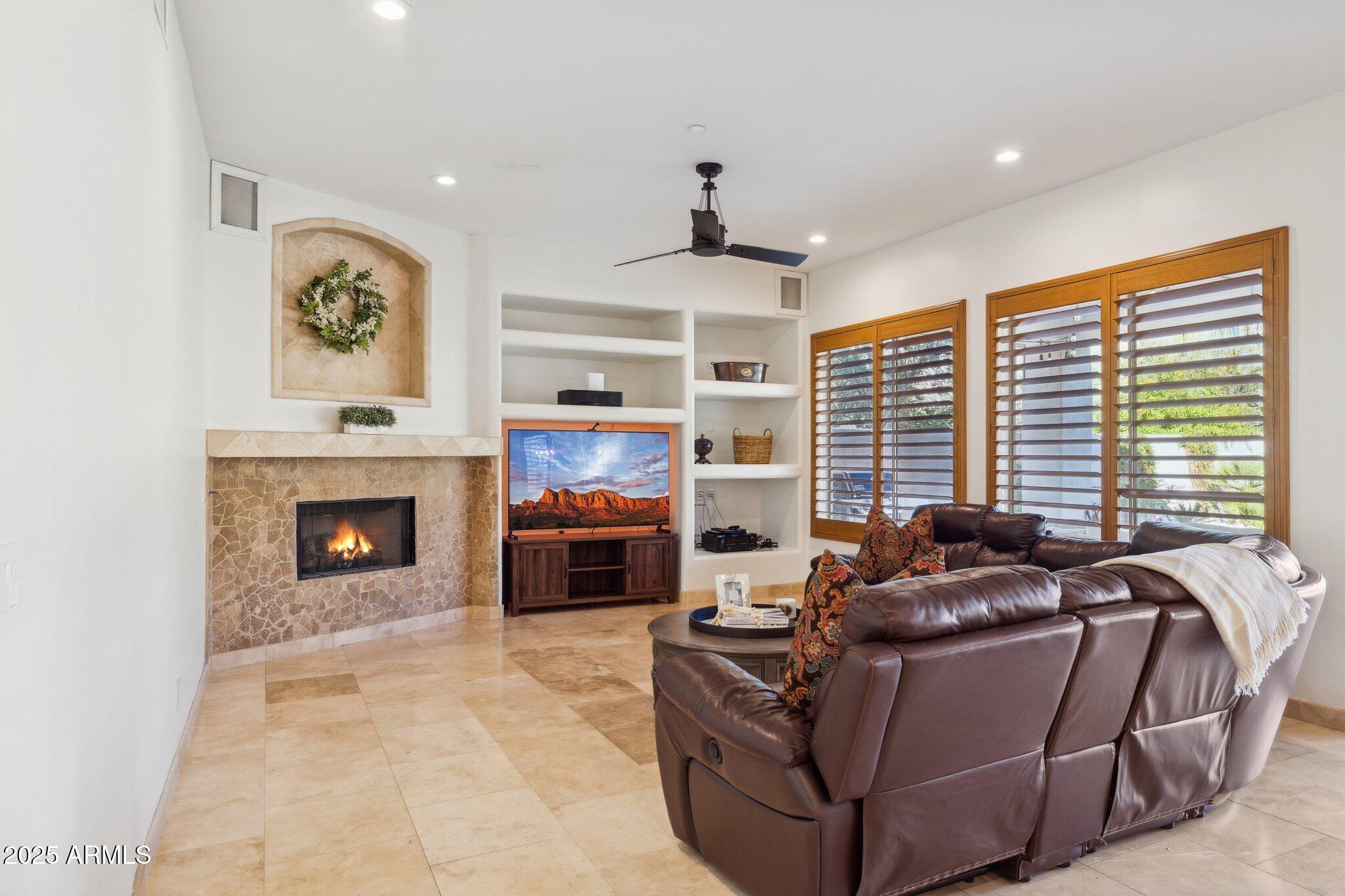 13174 East Geronimo Road Scottsdale, AZ 85259 - Photo 35 of 60 a living room with furniture and a fireplace