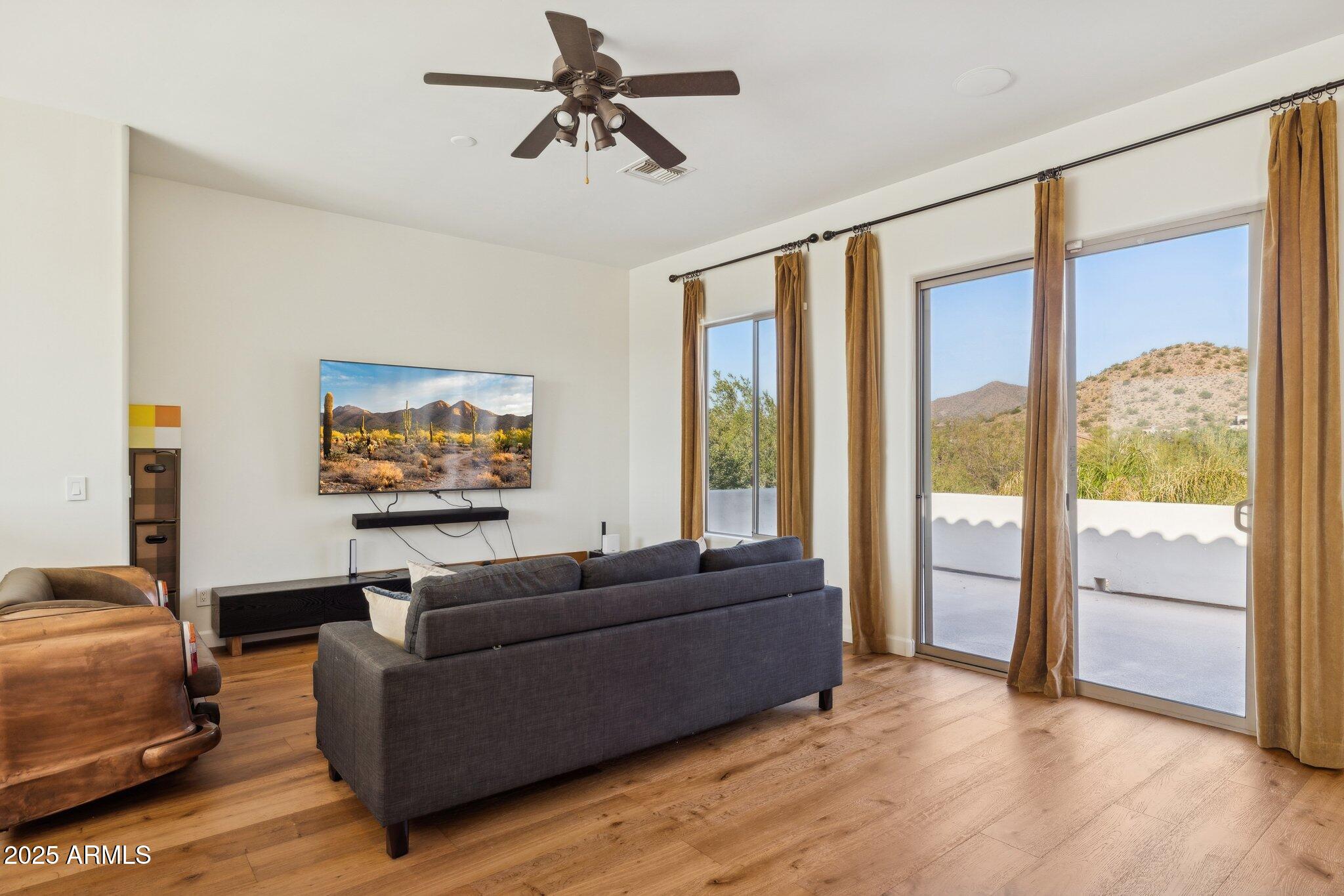 13174 East Geronimo Road Scottsdale, AZ 85259 - Photo 37 of 60 a living room with furniture and a large window