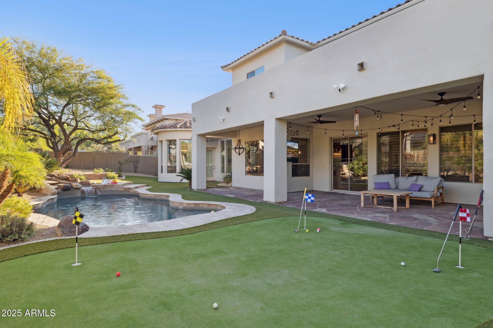 13174 East Geronimo Road Scottsdale, AZ 85259 - Photo 50 of 60 a view of a house with a backyard porch and sitting area