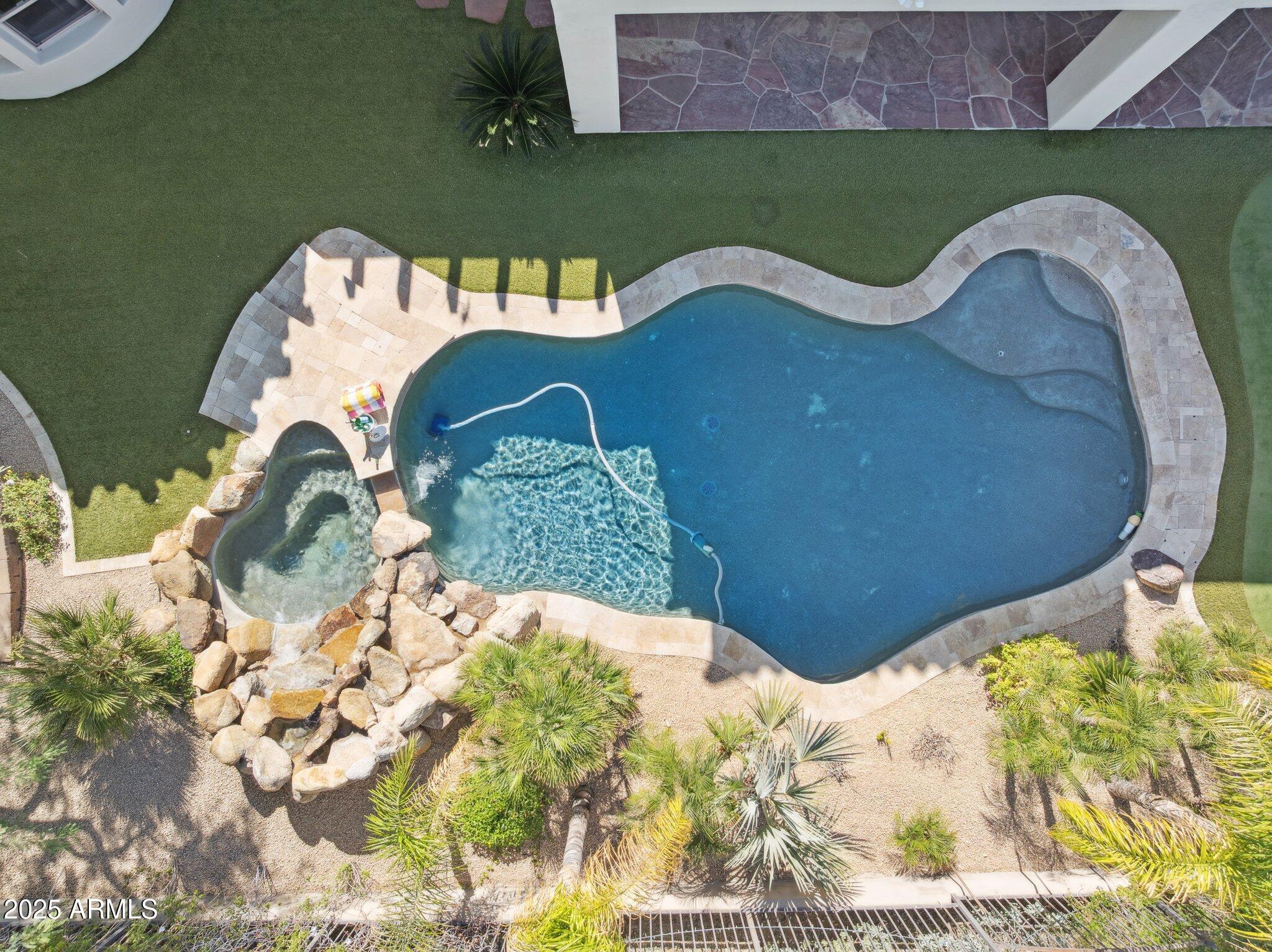 13174 East Geronimo Road Scottsdale, AZ 85259 - Photo 7 of 60 a view of a swimming pool with a yard