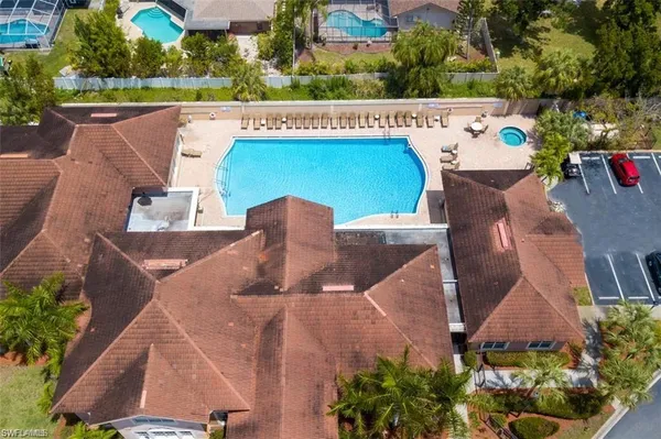 an aerial view of a house with outdoor space