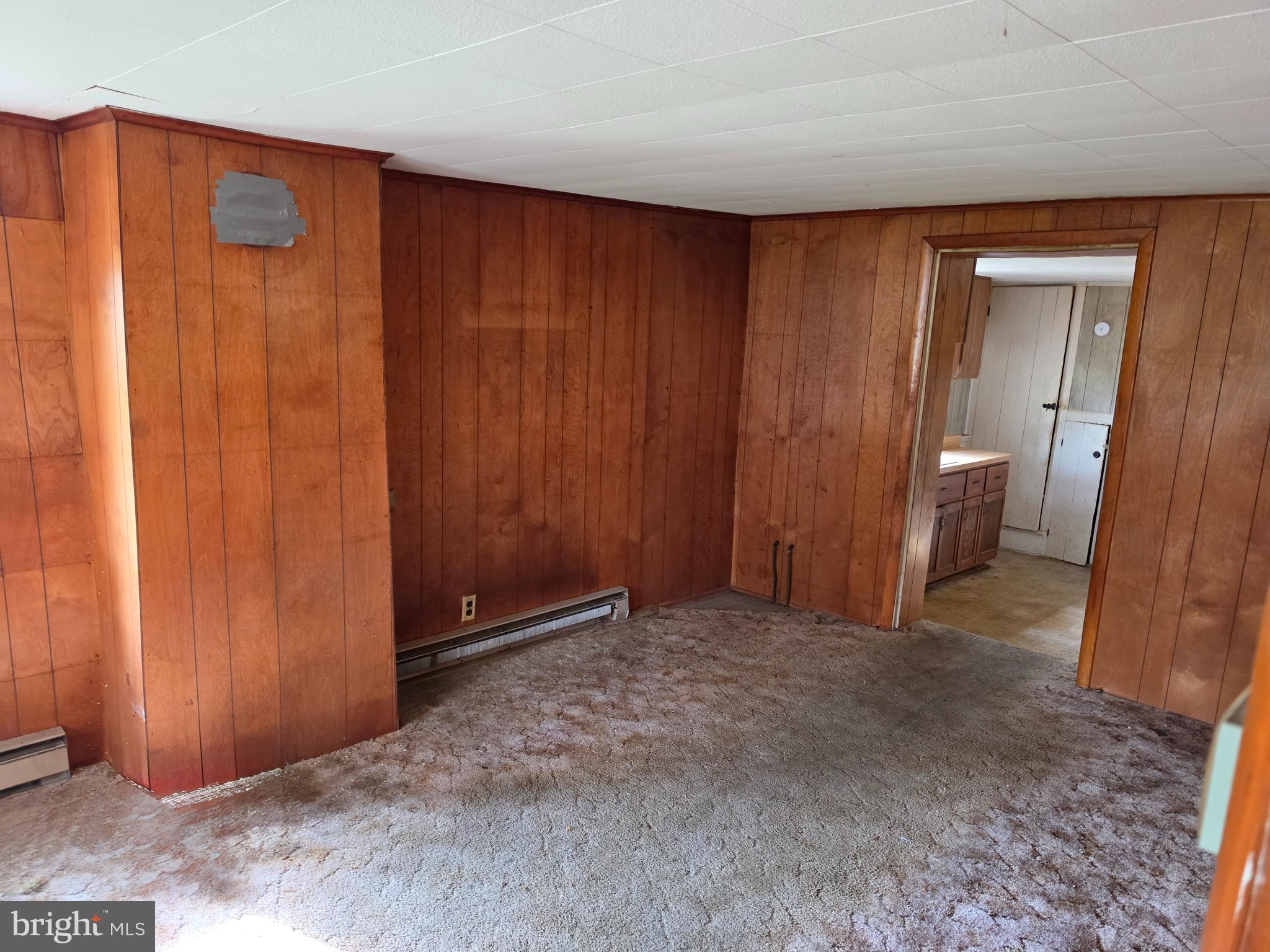 6018 Conover Road Taneytown, MD 21787 - Photo 6 of 18 a view of an empty room and a bathroom