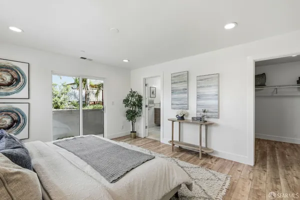 a bedroom with a bed and a chair