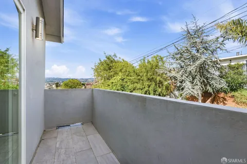 a view of a balcony with plants